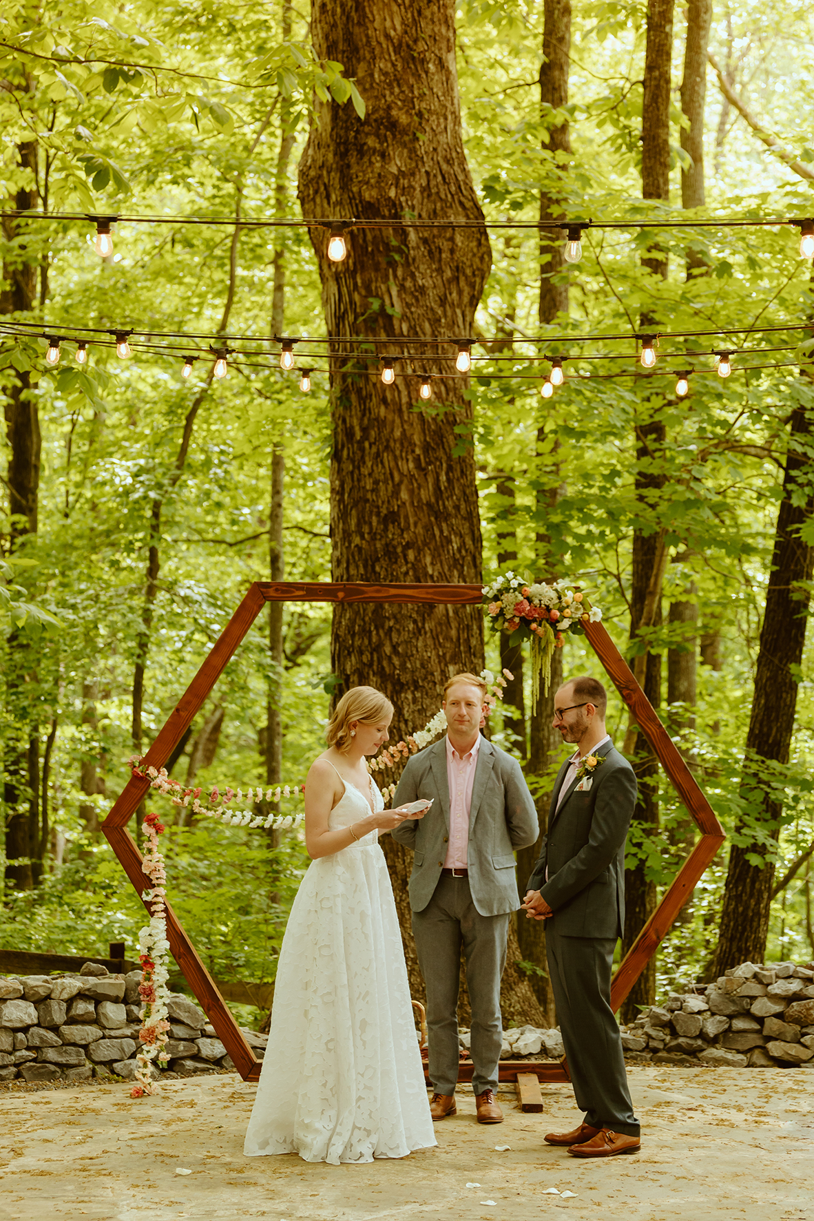 Forest wedding ceremony with hexagon arbor